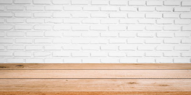 istock Vintage white of brick texture background with modern cream wood panel table top floorboards perspective for show advertise,promote product or item concept. 1019323928