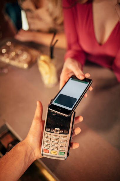 istock Paying for the Cocktails with her Smart Phone 1019324256