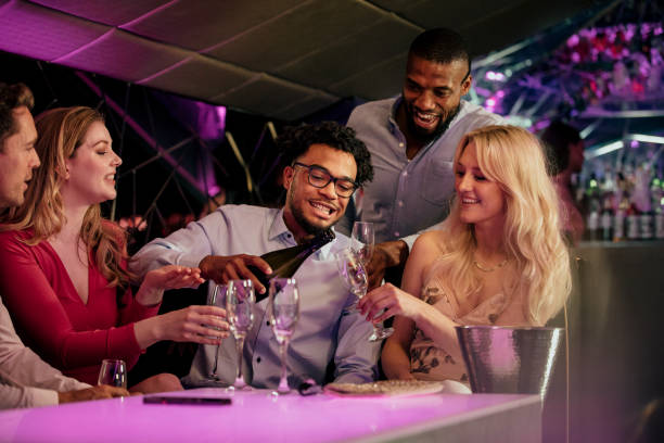 istock Friends Pouring Champagne 1019326948