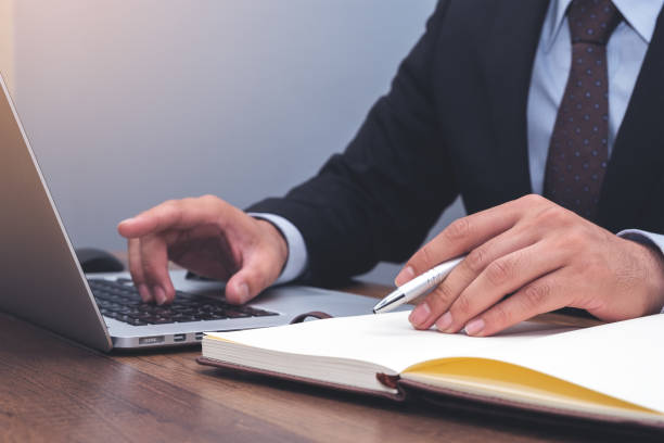 istock Young business man working on laptop, man's hands on laptop at workplace 1019334678