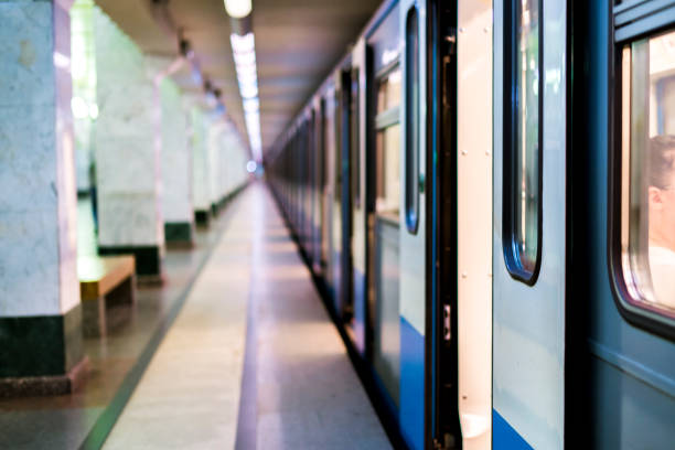 istock subway train staying on a metro station with doors open with defocused background 1019335474