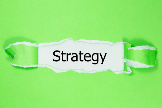 istock The word strategy appearing behind torn paper. 1019338532