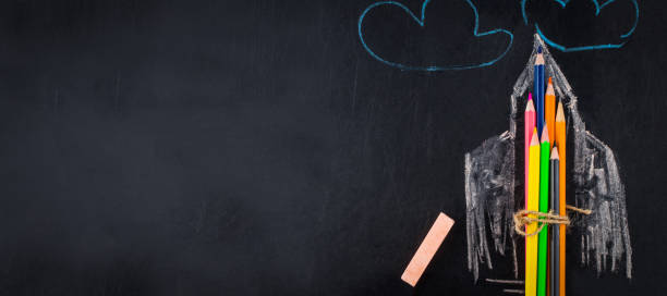 istock Back to school background with rocket made from pencils with copy space . View from above 1019338716