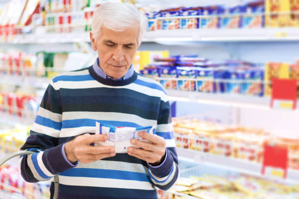 istock Senior man reading food label at a grocery store 1019338932