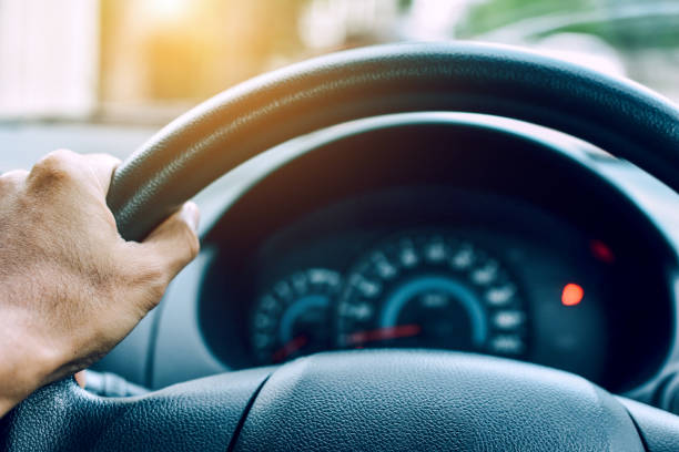 istock Man driving car on road transportation highway road 1019339470