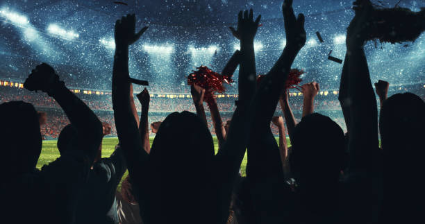 Fans celebrating the success of their favorite sports team on the stands of the professional stadium while it's snowing Fans celebrating the success of their favorite sports team on the stands of the professional stadium while it's snowing. Stadium is made in 3D. sports event stock pictures, royalty-free photos & images