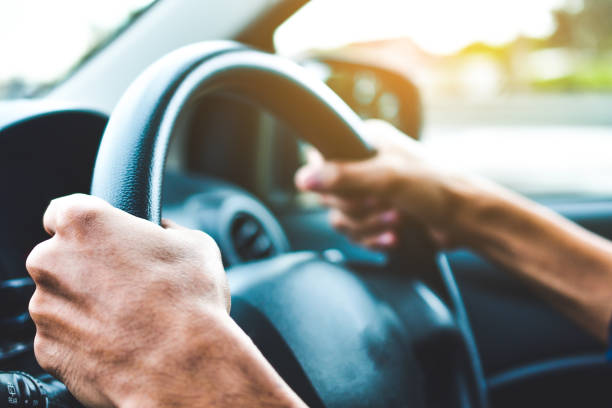 istock Man driving car on road transportation highway road 1019339670