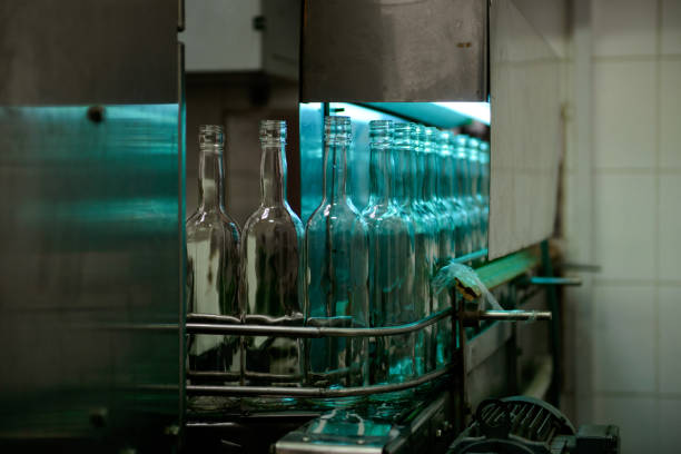 Glass bottles on the conveyor in factory