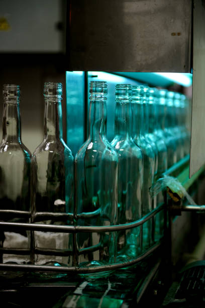istock Glass bottles on the conveyor in factory 1019349906
