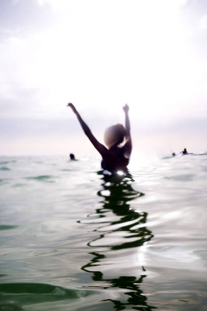 istock woman standing in the sea 1019350548