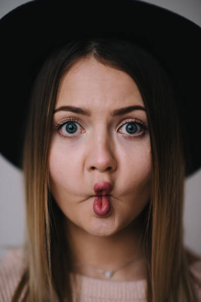 istock Blonde girl in hat, studio shot 1019350696