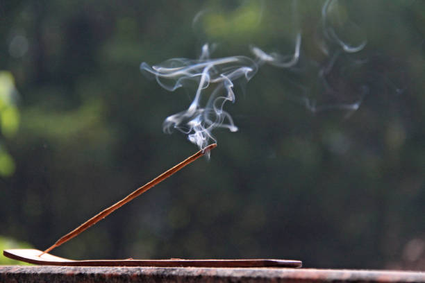 istock Incense stick and smoke from incense burning. Beautiful smoke. Blurred background and design with copy space 1019361768