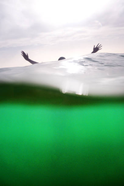 istock woman drowning in sea 1019361904