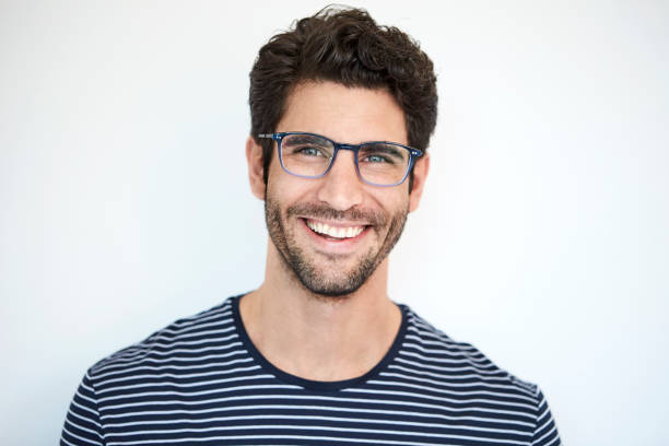 Happy dude in stripes Happy dude in striped top and glasses, portrait 25 year old man portrait stock pictures, royalty-free photos & images