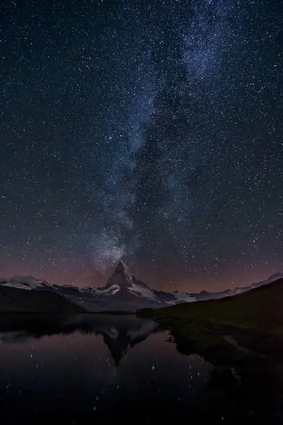 The Milky Way over the Matterhorn at Stellisse lake reflection on the lake - Zermatt Switzerland