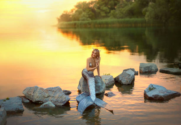 istock smiling mermaid on the stone 1019371952