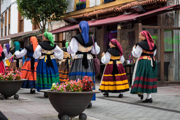 Women in Asturian regional costume of varied colors stock photo