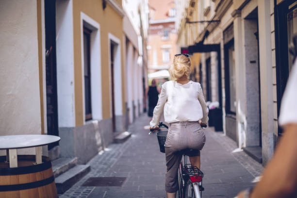 istock Blonde woman riding a bicycle 1019375184