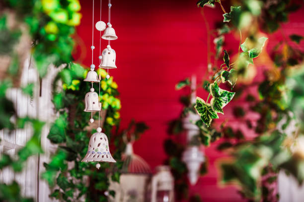 istock decorative bells at the red wall bachground 1019384512