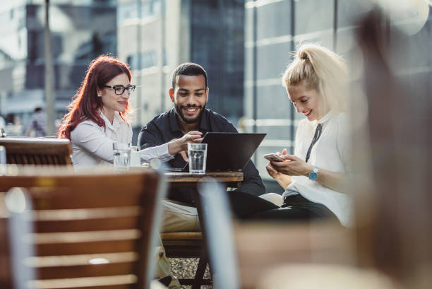 istock Business People Discussing at a Sidewalk Caffe 1019385690