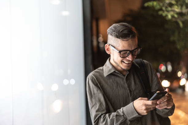 istock Business man using mobile at street 1019386004