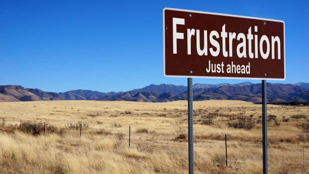 istock Frustration road sign with blue sky 1019386106