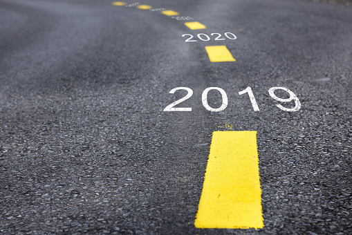 Number of 2019 to 2023 on asphalt road surface with marking lines