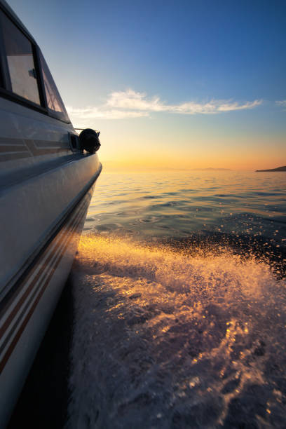istock White motorboat moving to sunset 1019389782