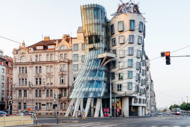 The Dancing House in Prague, Czech Republic Prague, Czech Republich - August 4, 2018: The Dancing House in the center of Prague, Czech republic. The building was designed by Vlado Milunic and Frank Gehry, built in 1996. dancing house prague stock pictures, royalty-free photos & images