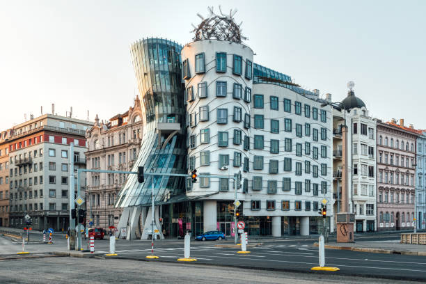 The Dancing House in Prague, Czech Republic Prague, Czech Republich - August 4, 2018: The Dancing House in the center of Prague, Czech republic. The building was designed by Vlado Milunic and Frank Gehry, built in 1996. dancing house prague stock pictures, royalty-free photos & images