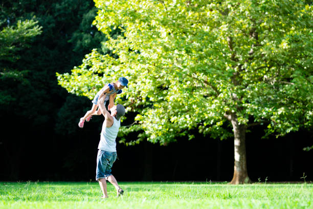 istock Father and daughter playing in the park 1019400442