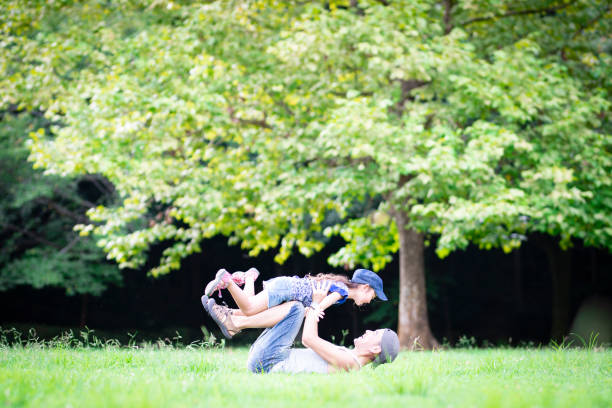 istock Father and daughter playing in the park 1019400446