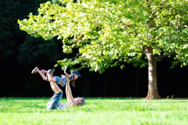 istock Father and daughter playing in the park 1019400474