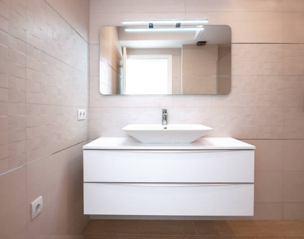 istock Modern design in the bathroom. Luxury white porcelain sink on a bathroom table. 1019403416