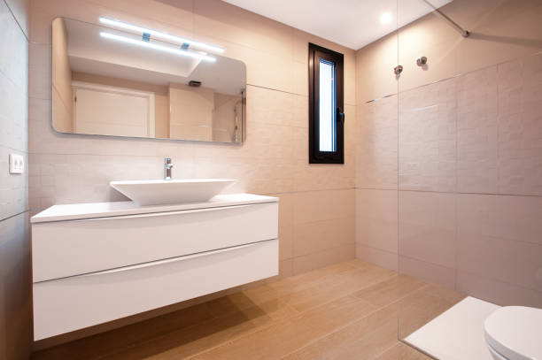 istock Modern design in the bathroom. Luxury white porcelain sink on a bathroom table. 1019403438