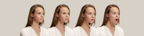 istock Beautiful woman looking suprised isolated on gray 1019406584