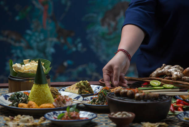 istock Waiter is serving table with different dishes. Waiter carrying plates with on some festive event, party or wedding reception 1019406678
