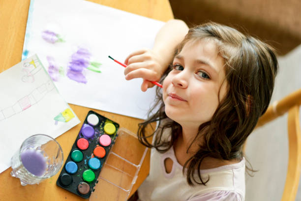istock Little cute girl painting inside 1019406736