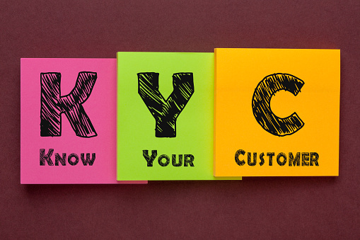 Know Your Customer (KYC) written on color notes. Business concept.