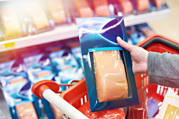 istock Pack of salmon in hand at store 1019418750