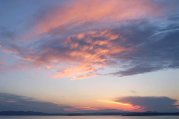 Beautiful sunrise in sea with dramatic clouds background