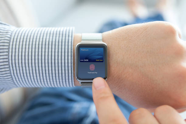 istock Man hands with smart watch debit card touch and pay 1019418874