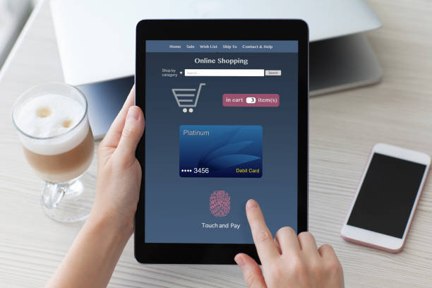 istock woman holding tablet PC computer with online shopping touch pay 1019419012