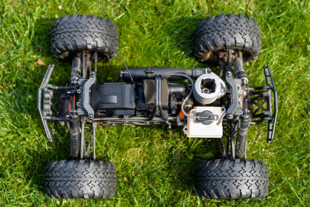 istock Radio-controlled car with internal combustion engine for nitro fuel, with one cylinder, standing on green grass. 1019423904