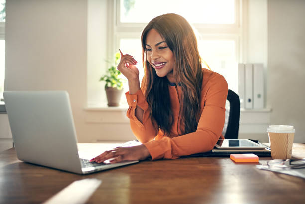 istock Female entrepreneur working on a laptop in her home office 1019423988