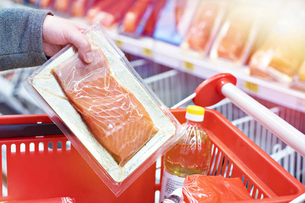 istock Pack of salmon in hand at store 1019424174