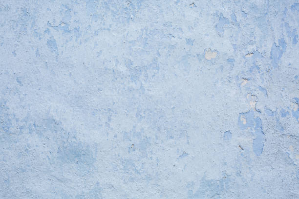 istock Concrete of a blue plastered wall. 1019424250