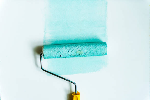 istock Flat lay of paint roller isolated on white background 1019424852