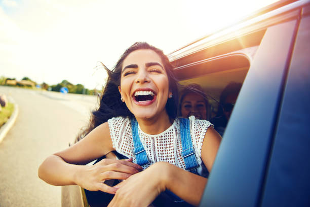 istock Attractive young woman in overalls laughs 1019427302