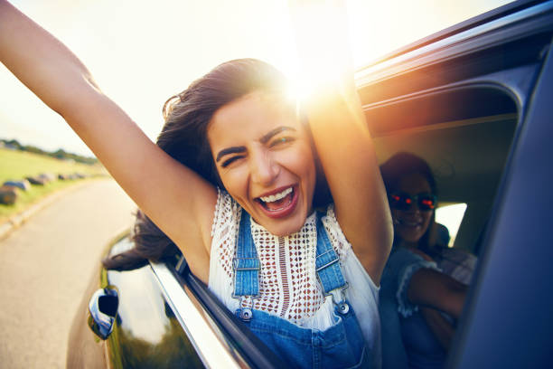 istock Exuberant young woman cheering with excitement 1019427308